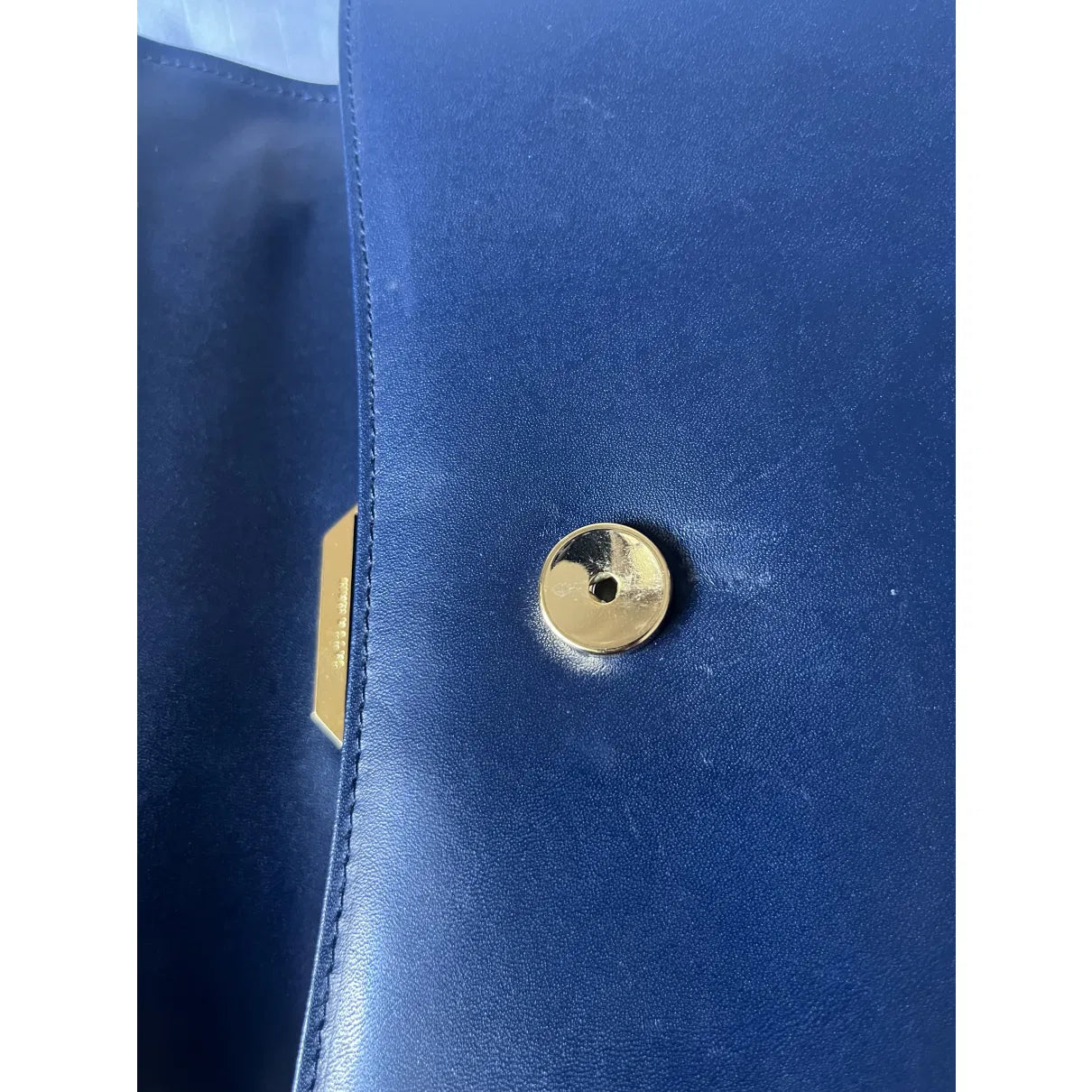 Navy leather bag with gold hardware