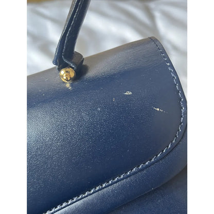 Navy leather bag with gold hardware