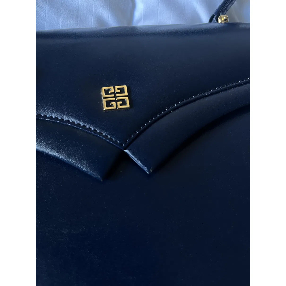 Navy leather bag with gold hardware