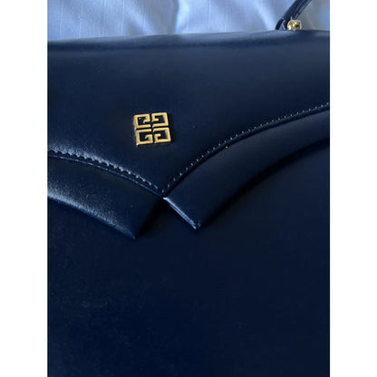 Navy leather bag with gold hardware