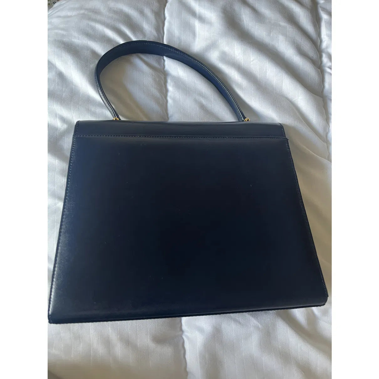 Navy leather bag with gold hardware