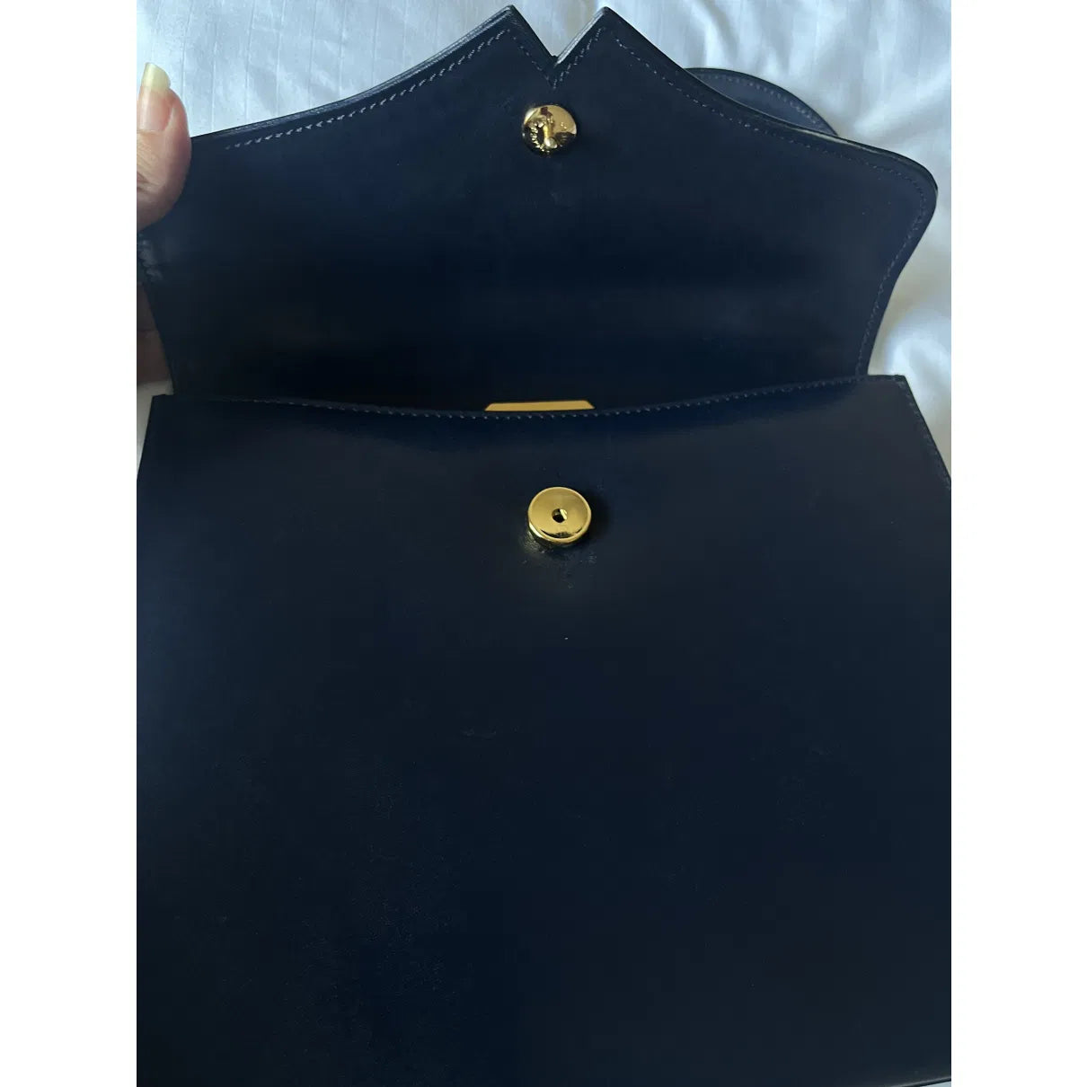 Navy leather bag with gold hardware