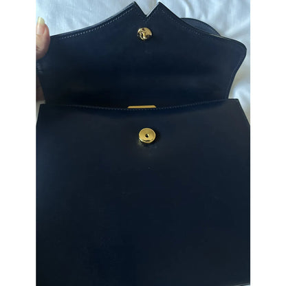 Navy leather bag with gold hardware