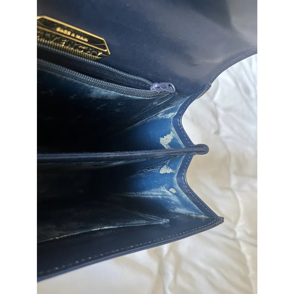 Navy leather bag with gold hardware