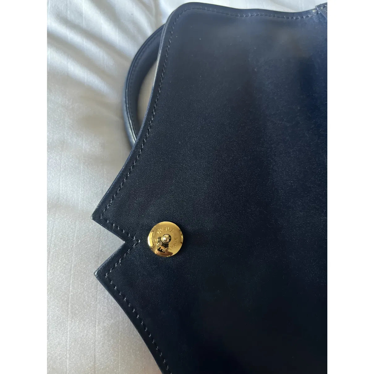 Navy leather bag with gold hardware