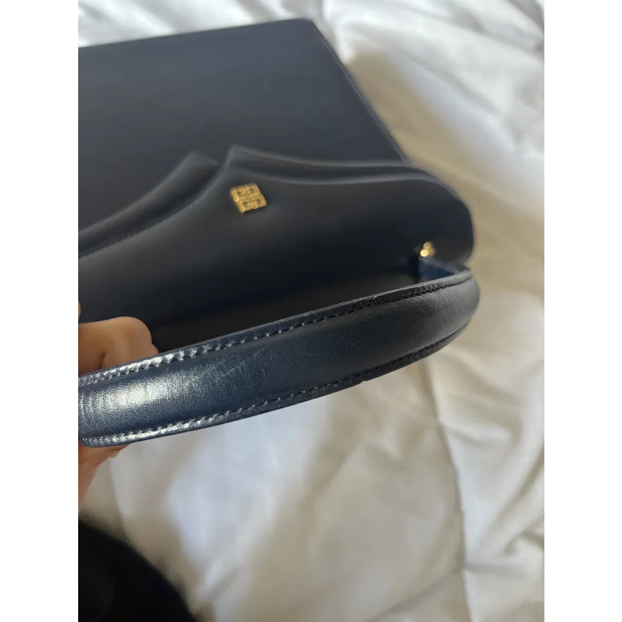 Navy leather bag with gold hardware