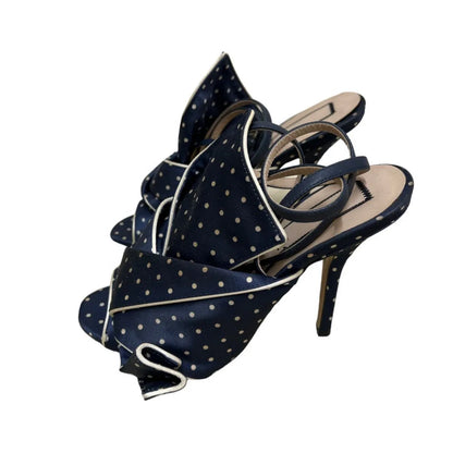 Polka dot mules in navy