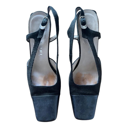 Slingback mules in black leather