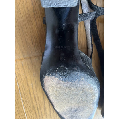 Slingback mules in black leather