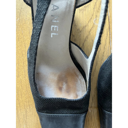 Slingback mules in black leather