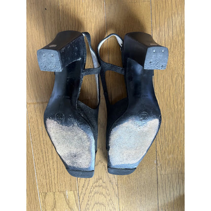Slingback mules in black leather